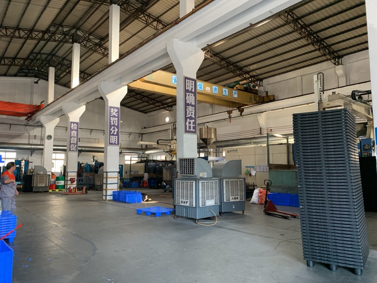 Factory workshop — sunlight striking Check & Supervise banner, May 2021